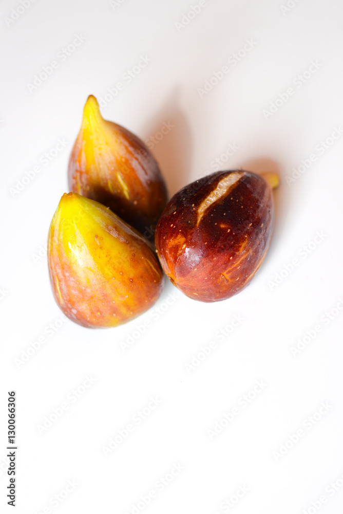 Fototapeta premium Close up view of figs on white table background