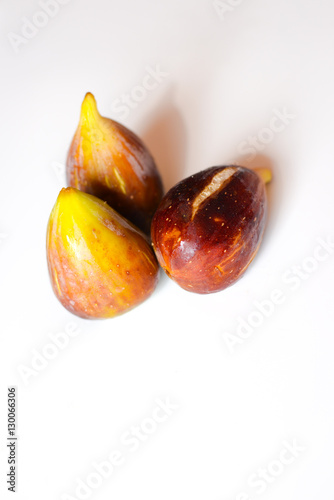 Close up view of figs on white table background photo