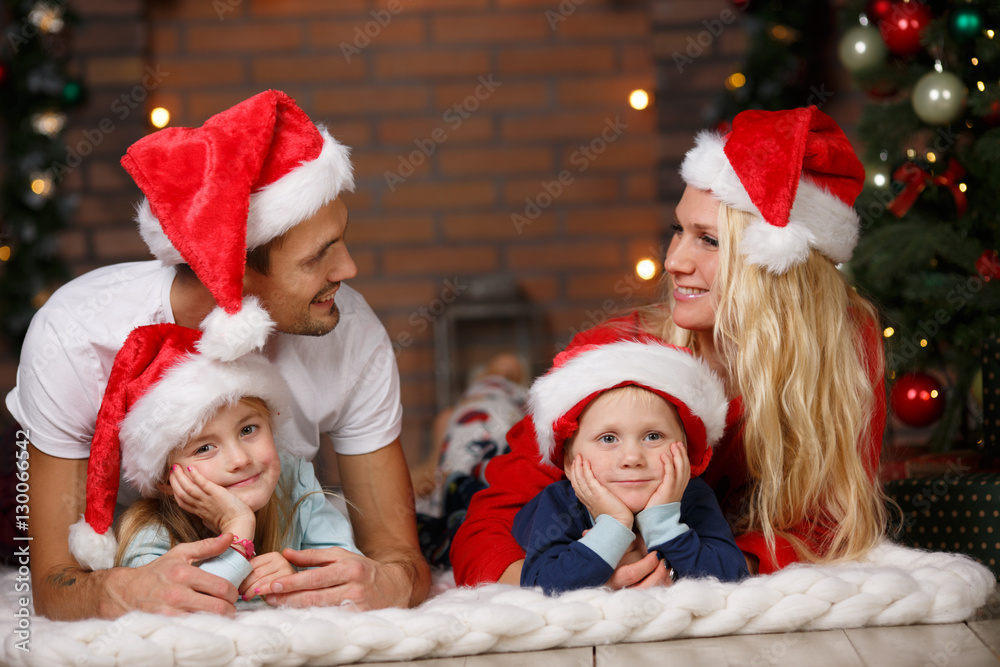 Couple with children on plaid Stock-Foto | Adobe Stock