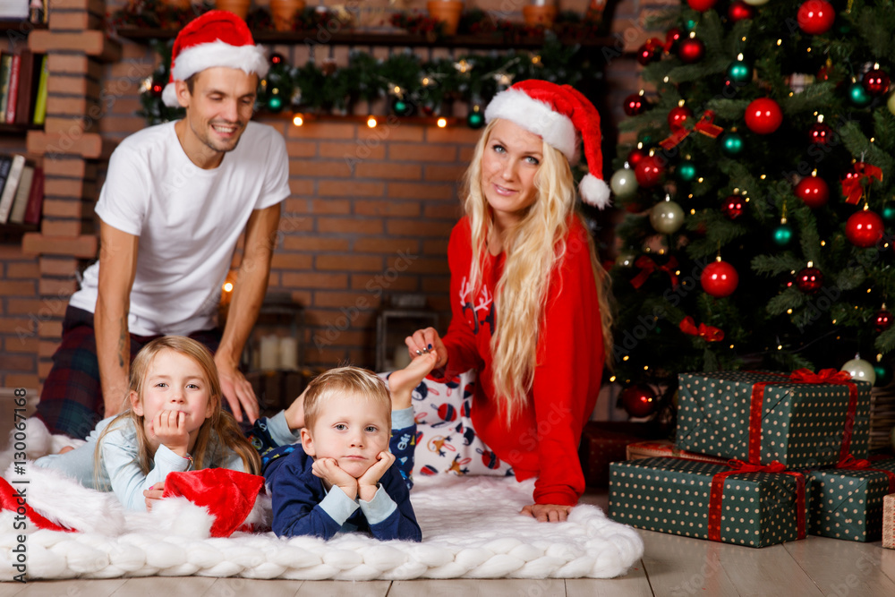 Couple with children background fireplace Couple with children background fireplace