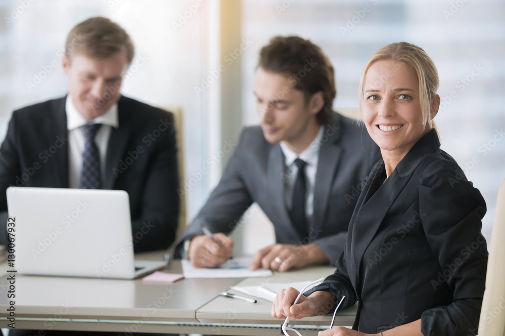 Group of businessmen at the modern office desk Group of businessmen at the modern office desk