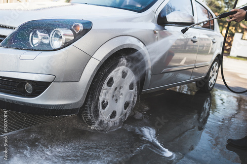 Car washing. Cleaning Car Using High Pressure Water.  © hedgehog94