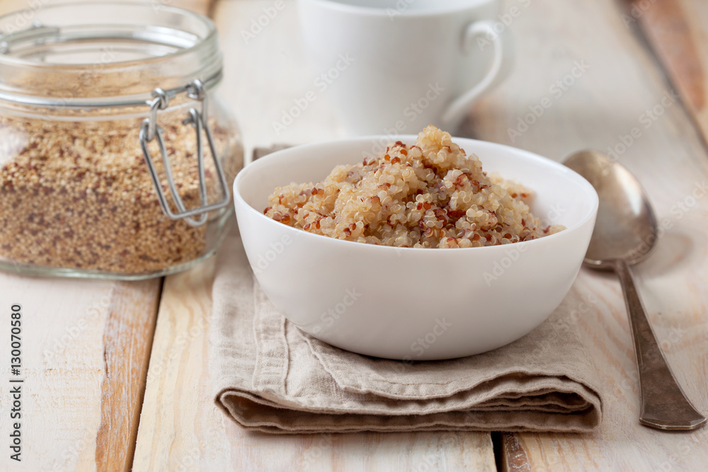 Cooked quinoa in a white bowl Cooked quinoa in a white bowl