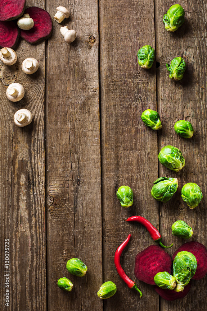 sliced brussels sprouts and peppers on slate wooden counter top background