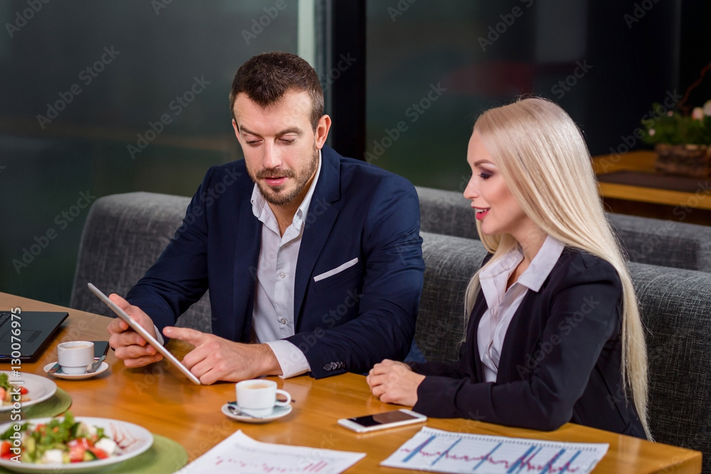 woman and man on business lunch woman and man on business lunch