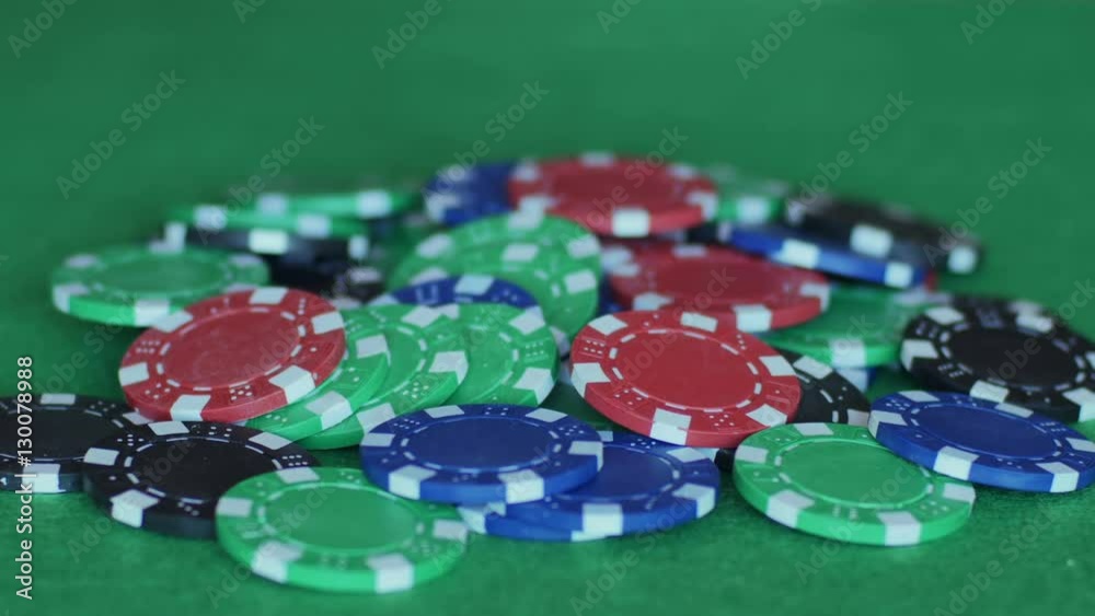 throwing in two red chips on pile of others in middle of gaming table and then throws out royal flush, ace, king, queen, lack and dice of hearts, betting, gambling, poker game. Close up, 4K Ultra HD. throwing in two red chips on pile of others in middle of gaming table and then throws out royal flush, ace, king, queen, lack and dice of hearts, betting, gambling, poker game. Close up, 4K Ultra HD.