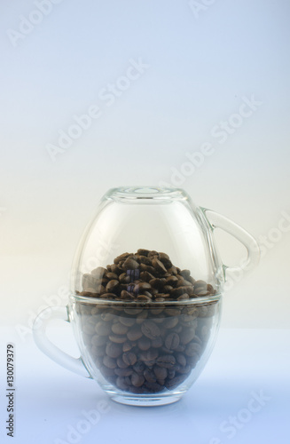 Coffee beans in transparent mugs