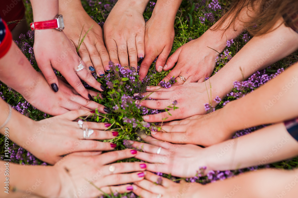 Fototapeta premium Hands of young people in the nature