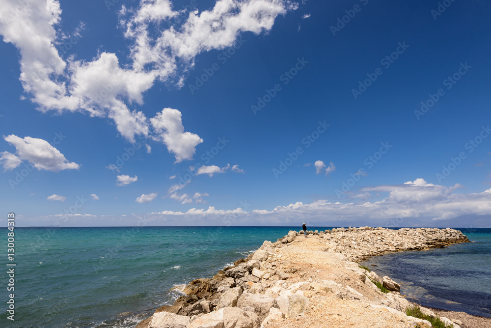 Seascape with amazing clouds on the sky near Acharawi village, Corfu, Greece.