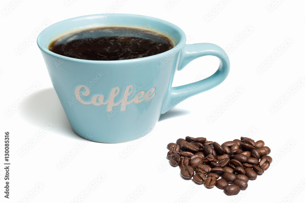 A blue cup of black coffee and a pile of coffee beans sharped like a heart on a white background A blue cup of black coffee and a pile of coffee beans sharped like a heart on a white background