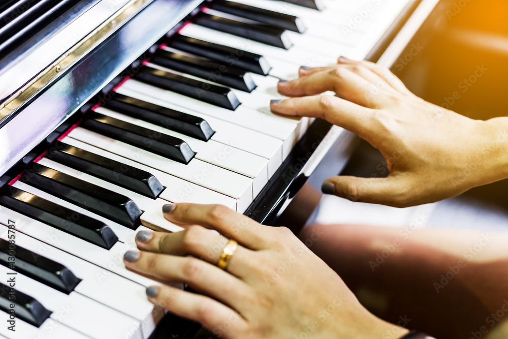 women playing piano. soft focus women playing piano. soft focus