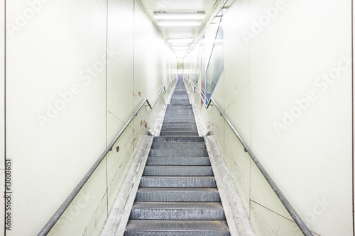 an metal staircase in a tunnel