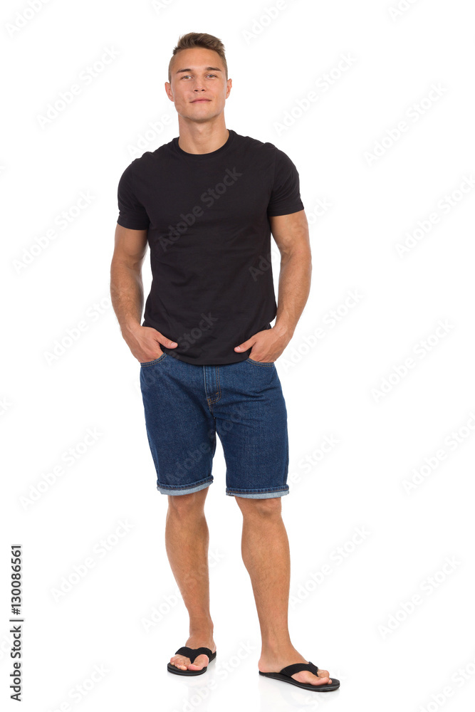 Cheerful Handsome Man In Jeans Shorts And Slipers Cheerful Handsome Man In Jeans Shorts And Slipers