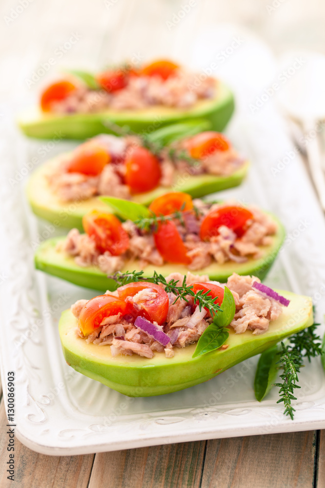 Stuffed avocado on tray. Stuffed avocado on tray.