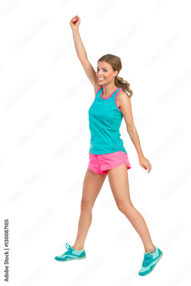 Jumping Woman In Sports Clothes Rising Arm Jumping Woman In Sports Clothes Rising Arm