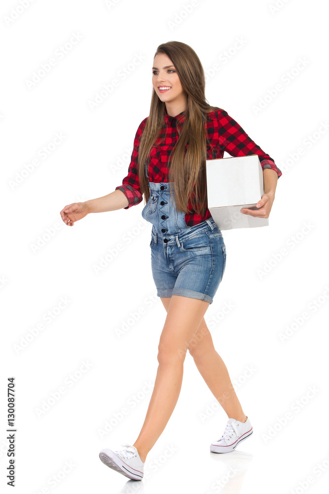 Walking Woman Worker Carrying White Box Under Her Arm Walking Woman Worker Carrying White Box Under Her Arm