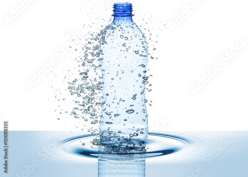 water bottle and bubbles above rippled wave isolated on white