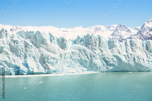 Frontal detailed view of Perito Moreno glaciar in argentinian Patagonia - World famous nature wonder of south american country of Argentina - Natural azure turquoise light blue color tones
