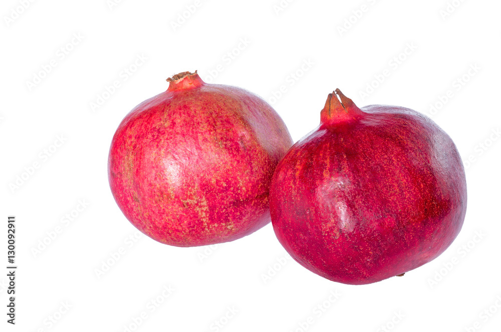 Two ripe pomegranate isolated on a white background. Two ripe pomegranate isolated on a white background.