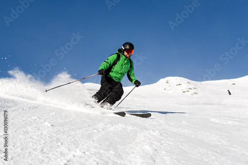 Skier skiing on ski slope