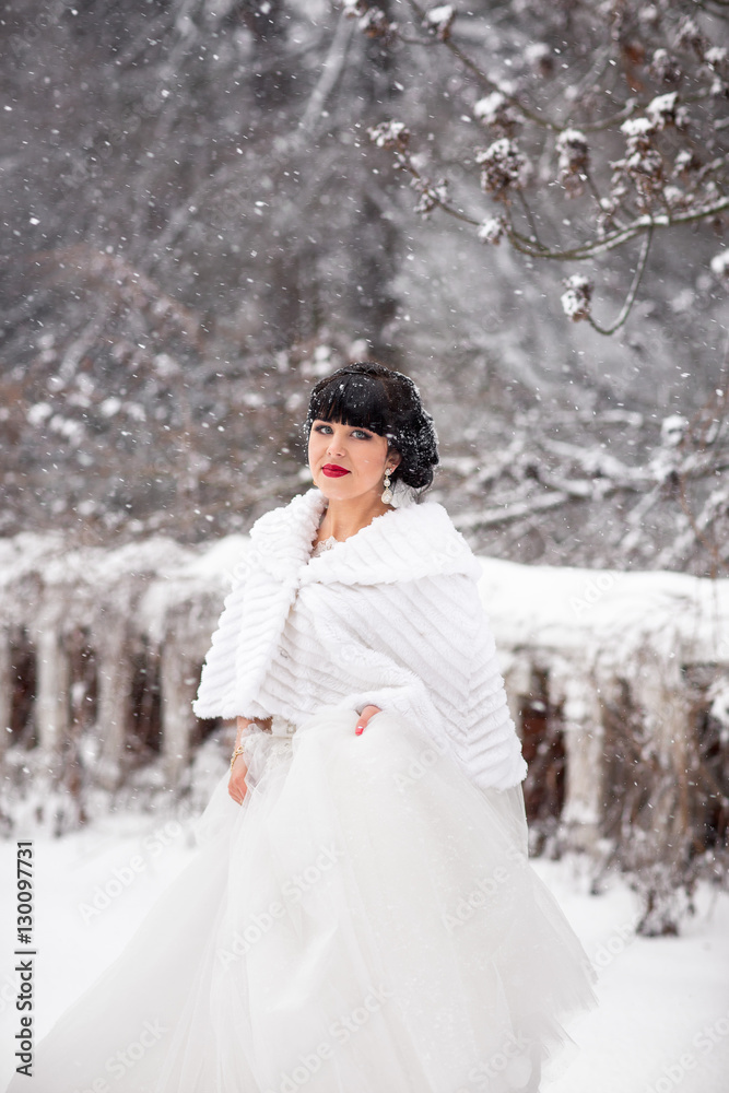 Winter wedding,portrait of beautiful asian bride in snowy winter day at wedding day Winter wedding,portrait of beautiful asian bride in snowy winter day at wedding day