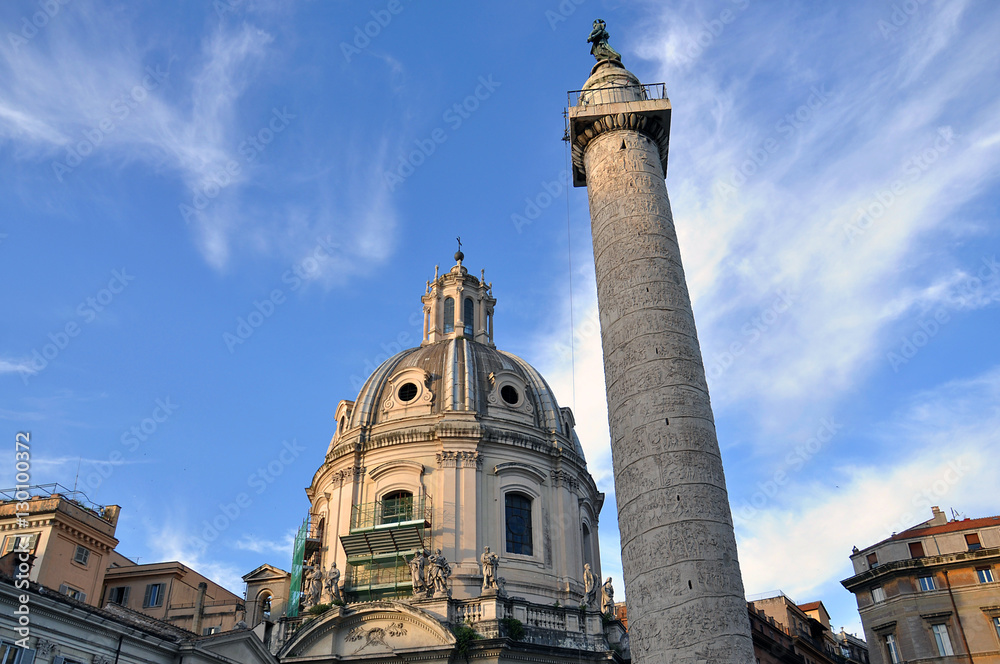 Ancient Church and a big column over the Roman Forum in Italy