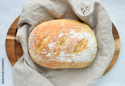 Wallpaper Mural fresh baked homemade sourdough bread loaf wrapped in linen with a flour top Torontodigital.ca