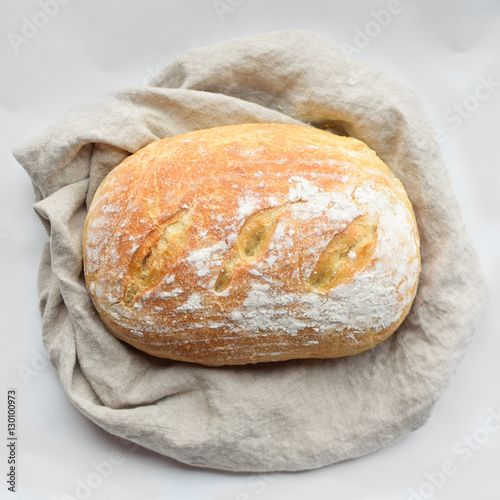 Wallpaper Mural fresh baked homemade sourdough bread loaf wrapped in linen with a flour top Torontodigital.ca