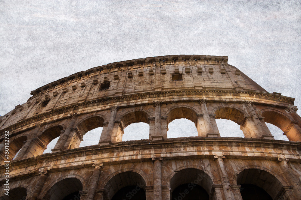 Roman Colloseum in Rome, Italy - low angle. Parchment background.
