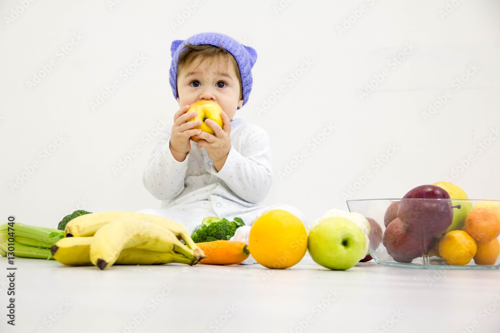 baby surrounded with fruits and vegetables, healthy child nutrition baby surrounded with fruits and vegetables, healthy child nutrition
