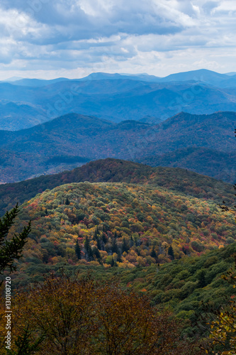 Light Highlights a Lower Mountain Covered in Fall Colors