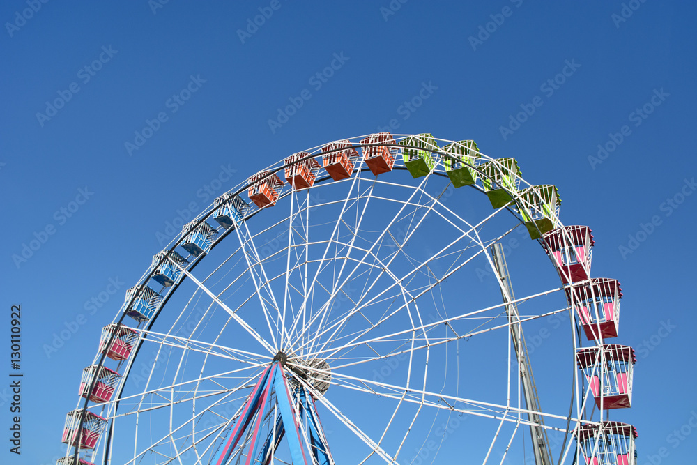 Colorful Amusement Park Big Wheel on Clear Blue Sky Colorful Amusement Park Big Wheel on Clear Blue Sky