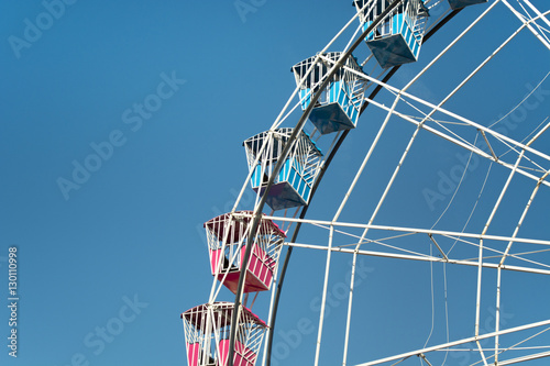 Colorful Amusement Park Big Wheel on Clear Blue Sky