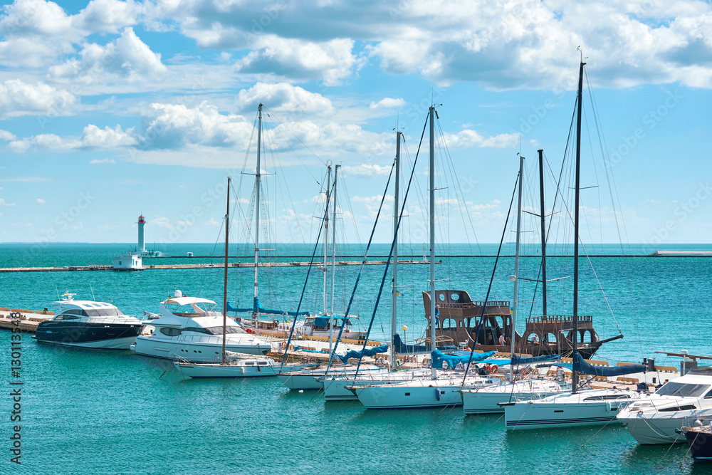 Obraz premium white yacht marina and cloudy sky