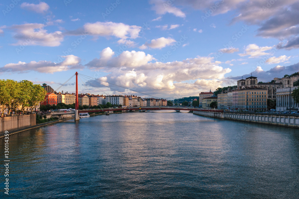 Fototapeta premium Lyon scenic view on river Saone with Passerelle Saint-Vincent and the Cathedral at sunset