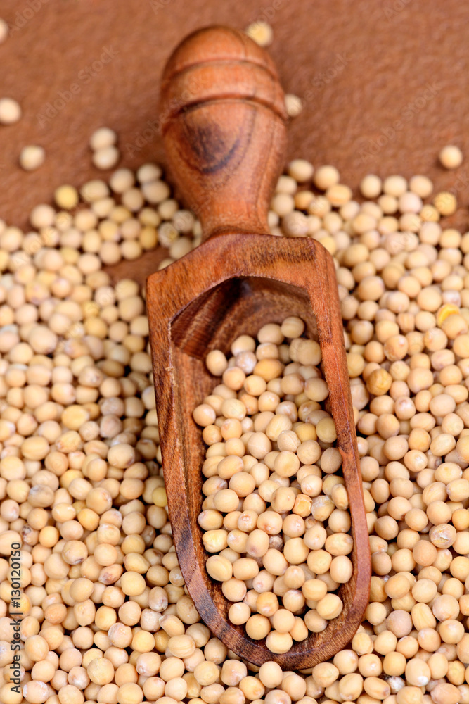 Fototapeta premium Wooden scoop with mustard seeds