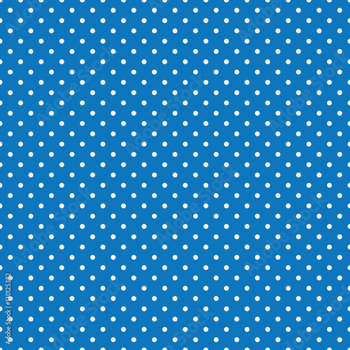 Seamless blue and white polka dot background.