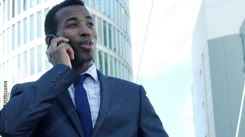 handsome black businessman at the phone handsome black businessman at the phone