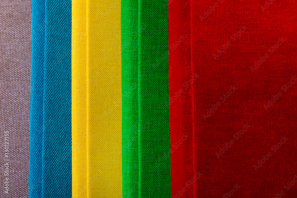 Fototapeta premium Multicolored book textile cover. Photobooks on a white background.