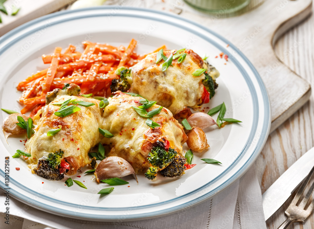 Roasted chicken thighs  stuffed with vegetables, baked with mozzarella cheese 