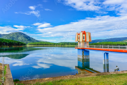 Beautiful of Tuyen Lam lake and the old man fishing.