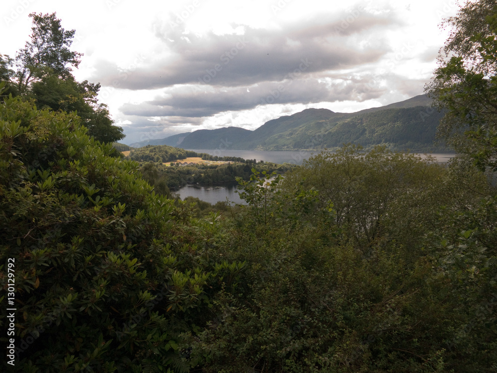 Trees and mountains surrounding Loch Ness