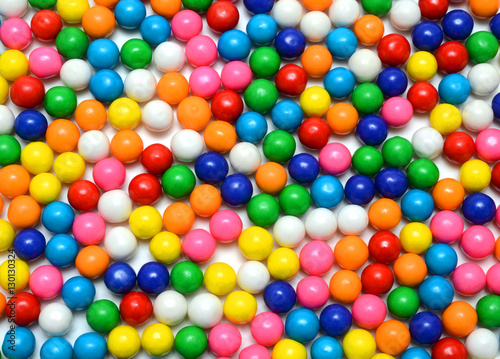 Colorful background of assorted shiny round gumballs