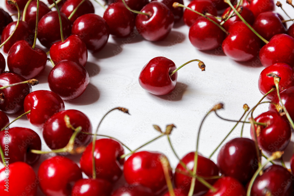 cherries on white table