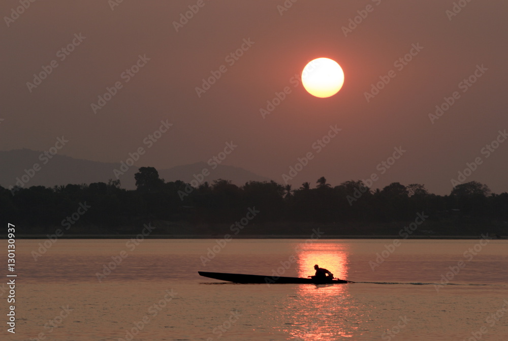 Sunset over the Mekong river, Pakse, southern Laos Sunset over the Mekong river, Pakse, southern Laos