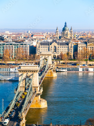 Famous Chain Bridge over Danube River, Gresham Palace and Saint Stephen's Basilica view from Buda Castle on sunny autumn day in Budapest, capital city of Hungary, Europe. UNESCO World Heritage Site