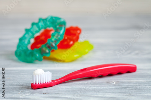 children s toothbrush oral care on wooden background