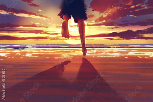 Obraz mężczyzna biegnie po plaży w stronę wschodzącego słońca