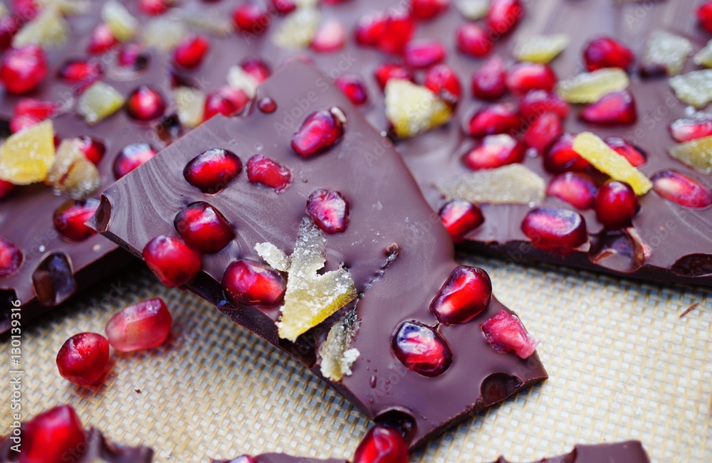 Dark chocolate bark with fresh pomegranates and candied ginger