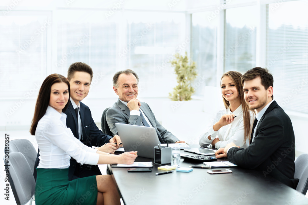 successful businessman and his business team meeting successful businessman and his business team meeting